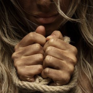close-up-photo-of-woman-with-her-hands-tied-with-rope-1435441